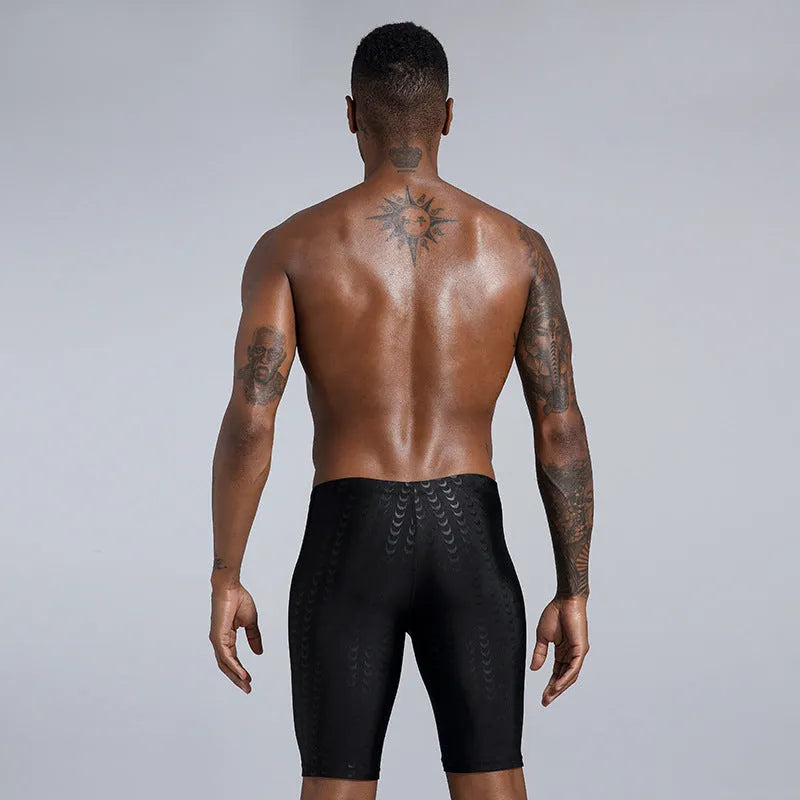 Men's solid colour swimming trunks in shark skin polyester fabric for beach surfing and swimming