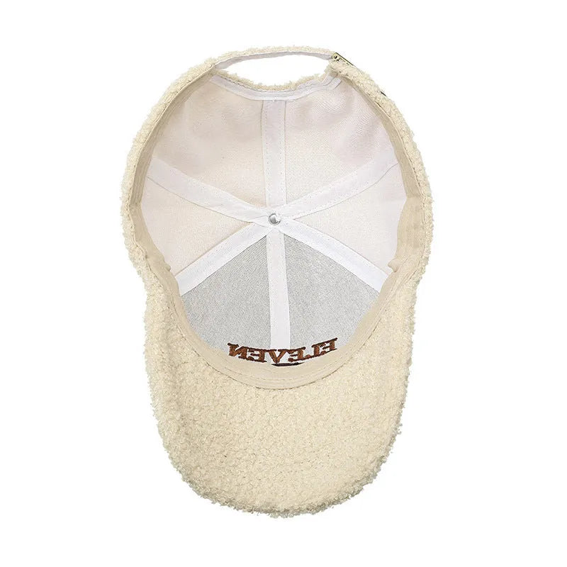 Adjustable winter baseball cap in lambskin polyester fabric showing dome crown design