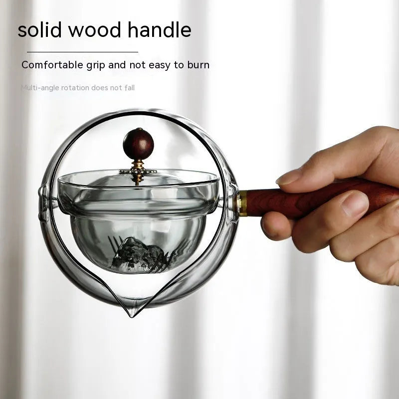 Semi-automatic rotary glass teapot with wooden handle and infuser in transparent borosilicate glass
