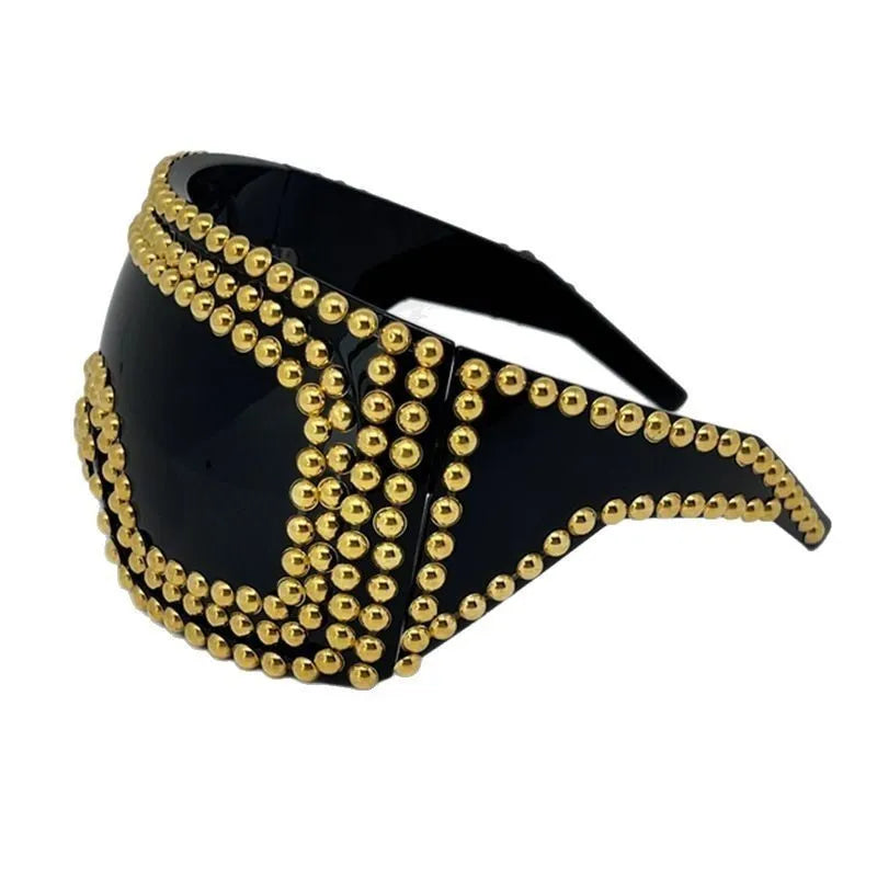 Men's square punk sunglasses with large rim and silver rivets on a dark background.