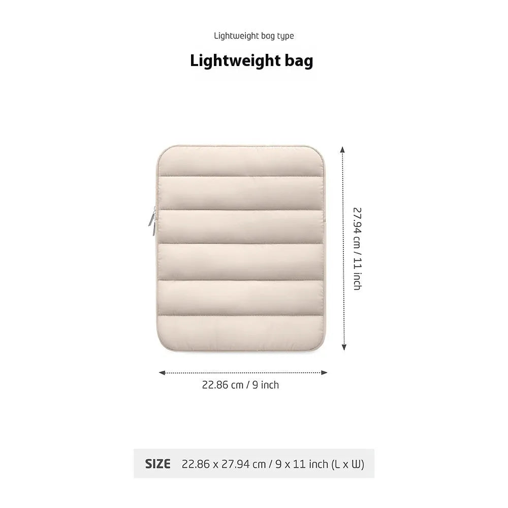 Fluffy black laptop sleeve puff bag with elastic closure for a 9.7 to 11 inch device.