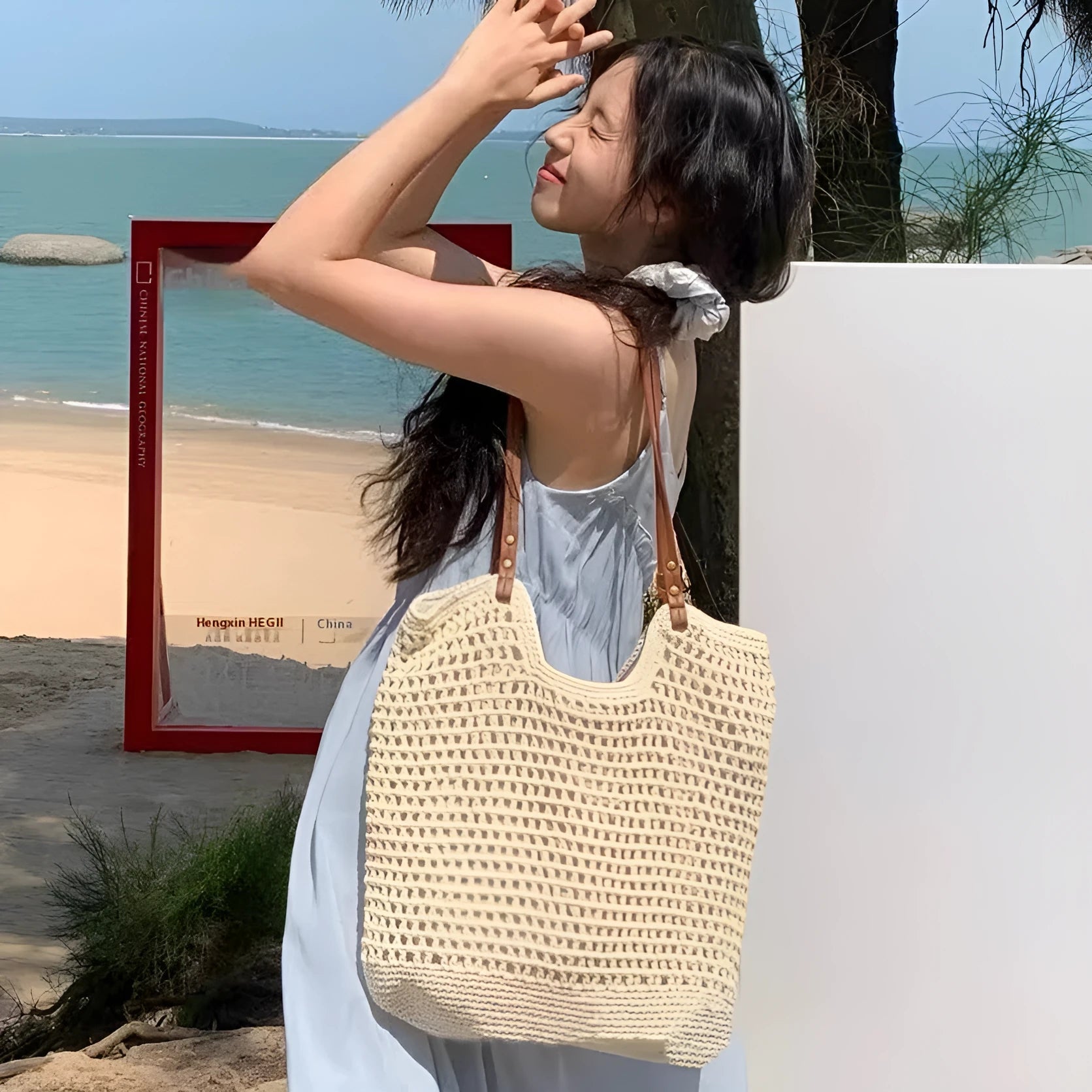 Beige woven cotton linen shoulder bag showing textured material and magnetic snap closure