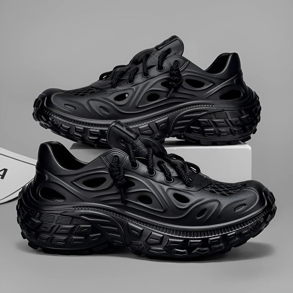 Men's black EVA sandals with thick sole, covered heel, and breathable hollow-out upper design.