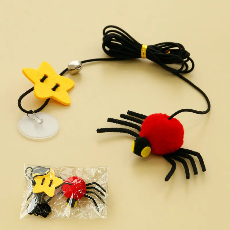 Red hanging door cat toy with elastic rope, feather, bell, and spider attachment