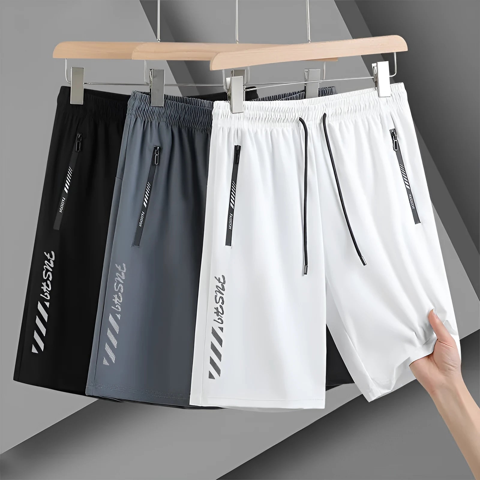 Man wearing black loose-fit quick-dry nylon sports shorts.