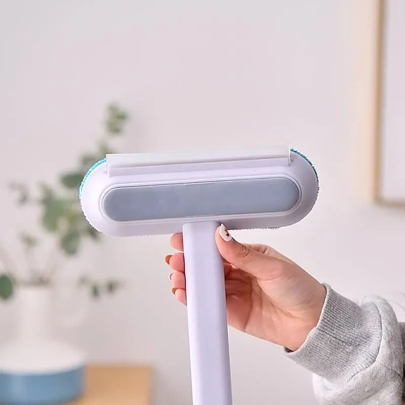 Multifunctional hair removal and window screen cleaning brush with blue flannel head and white plastic handle.