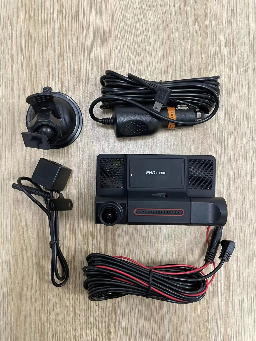 Black three-lens dash cam with 4-inch touchscreen display for front and rear vehicle recording
