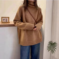 Red women's loose turtleneck sweater with a thick curling pile collar and a 3D pattern texture.