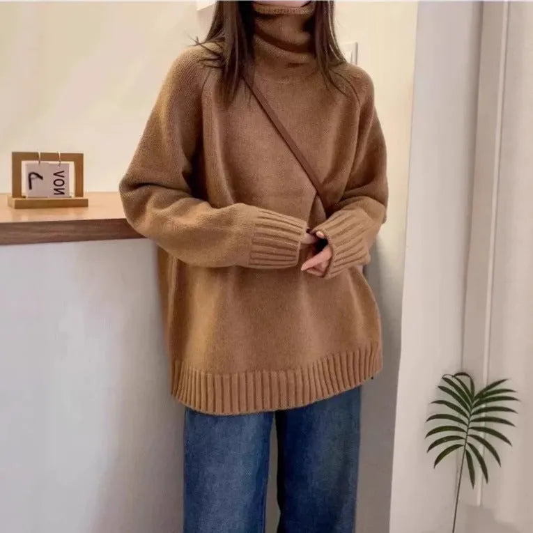 Red women's loose turtleneck sweater with a thick curling pile collar and a 3D pattern texture.