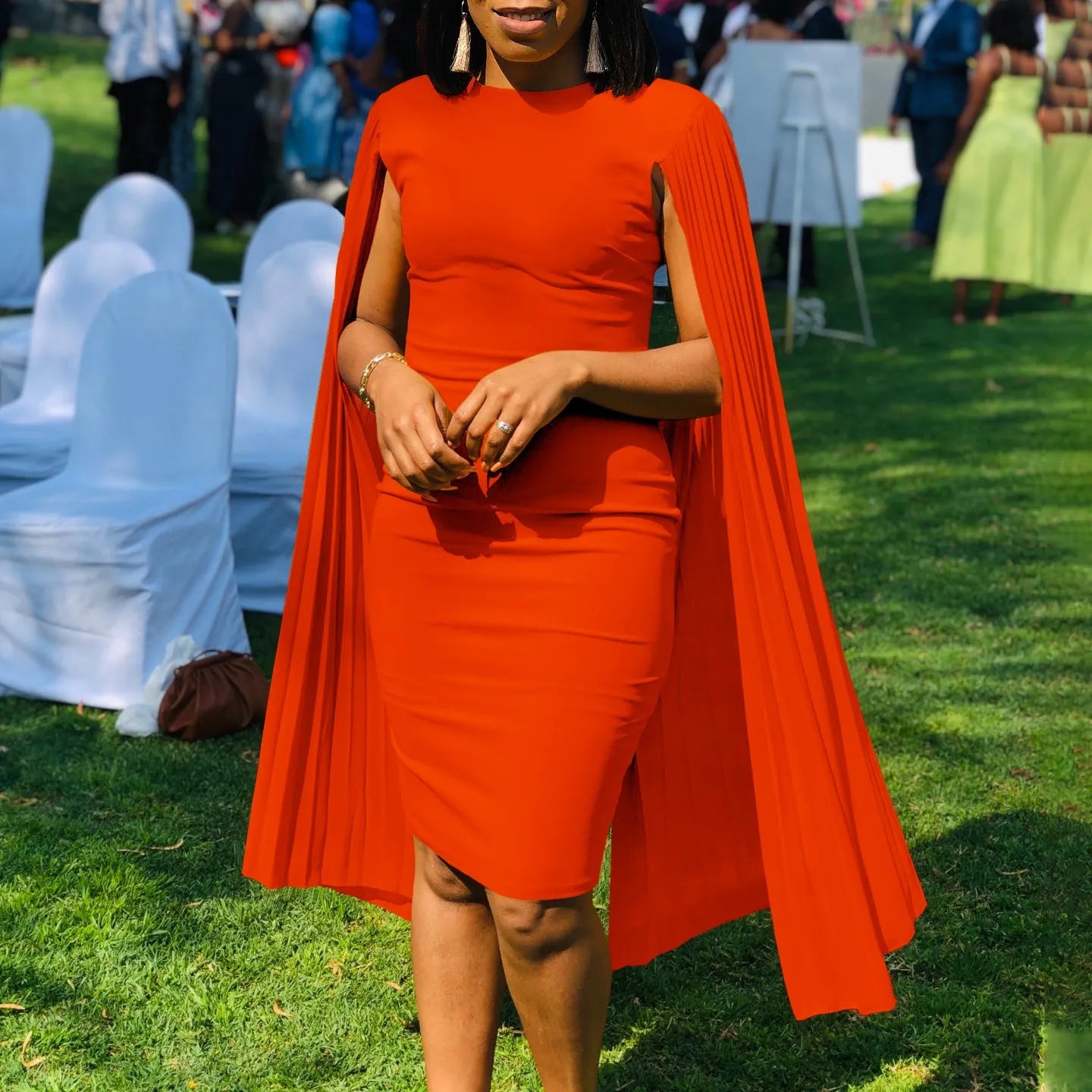 Long sleeve high waist pleated evening gown in yellow, orange, red, or green.