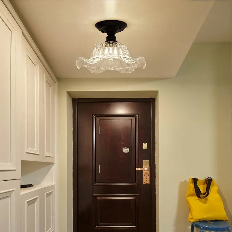American retro single-head ceiling lamp with clear glass shade showing exposed filament style