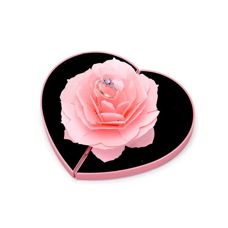 Red heart-shaped rotating plastic ring box for jewellery presentation