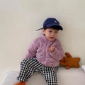 Blue children's sherpa fleece winter coat with full zip and standing collar on a hanger