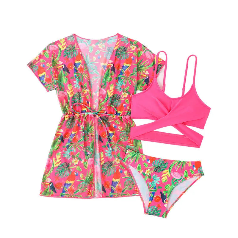 Girls floral print bikini swimsuit on hanger, showing two-piece design and overlay detail.