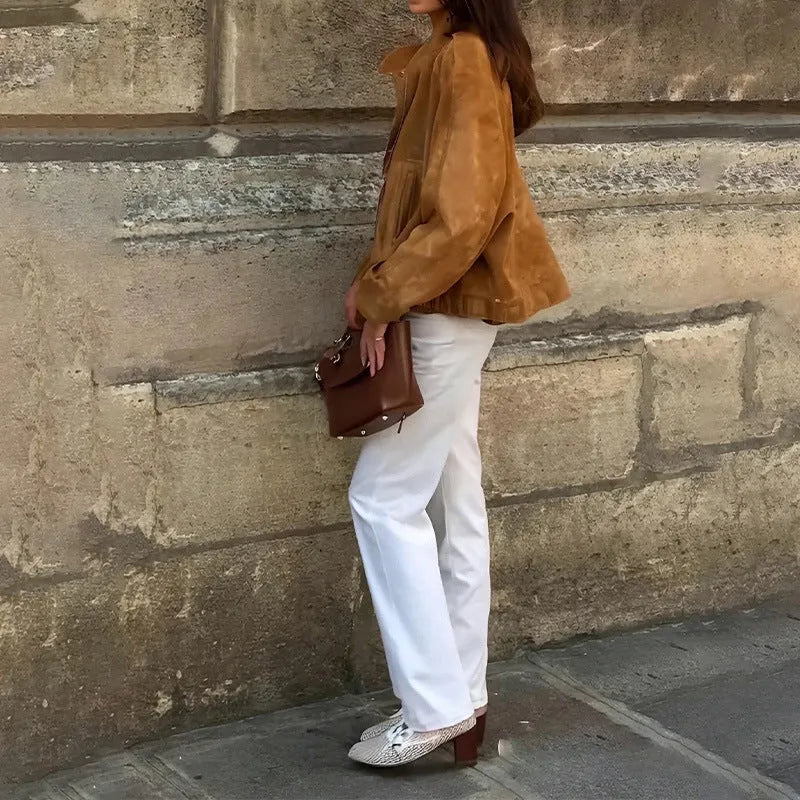 Man's solid colour retro loose-fit polyester jacket with long sleeves on a hanger.