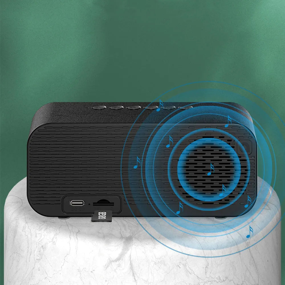 Black Bluetooth alarm clock speaker with LED digital display and night light on bedside table