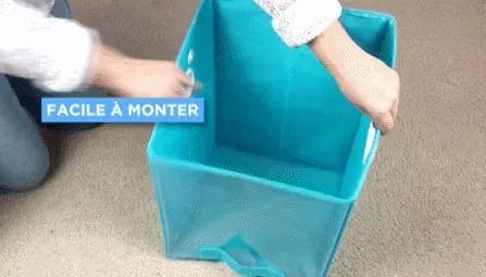 Blue folding storage basket with detachable liner on shelving, showing clear front panel and padded sides