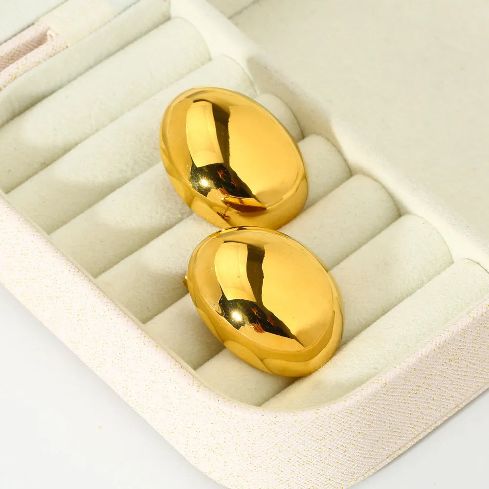 Geometric women's ear studs with a glazed gold electroplated finish and line detailing.