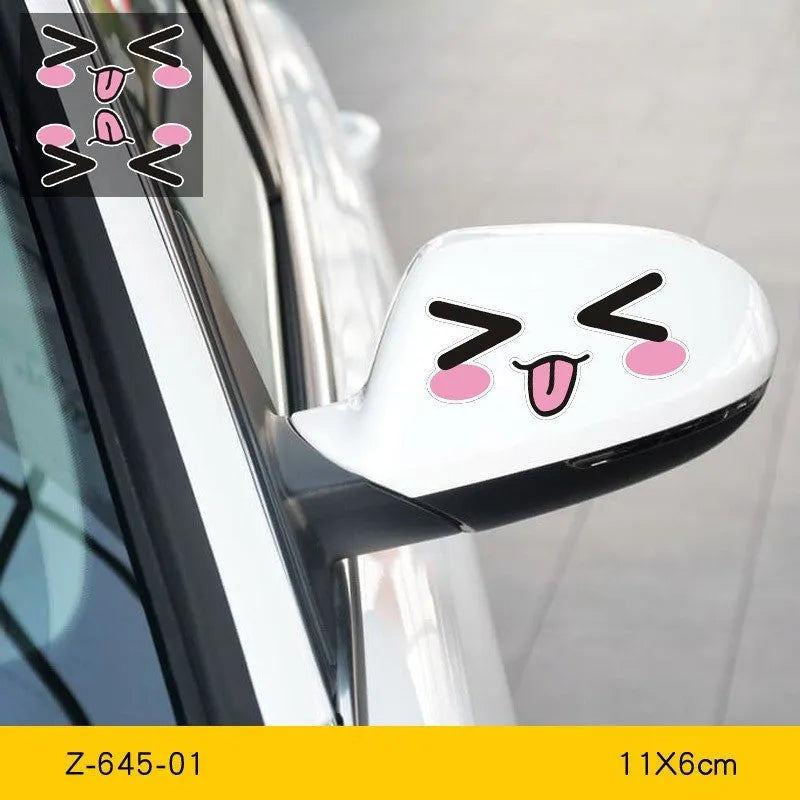 Pair of reflective cartoon eyes car stickers on a white background, showing adhesive backing.