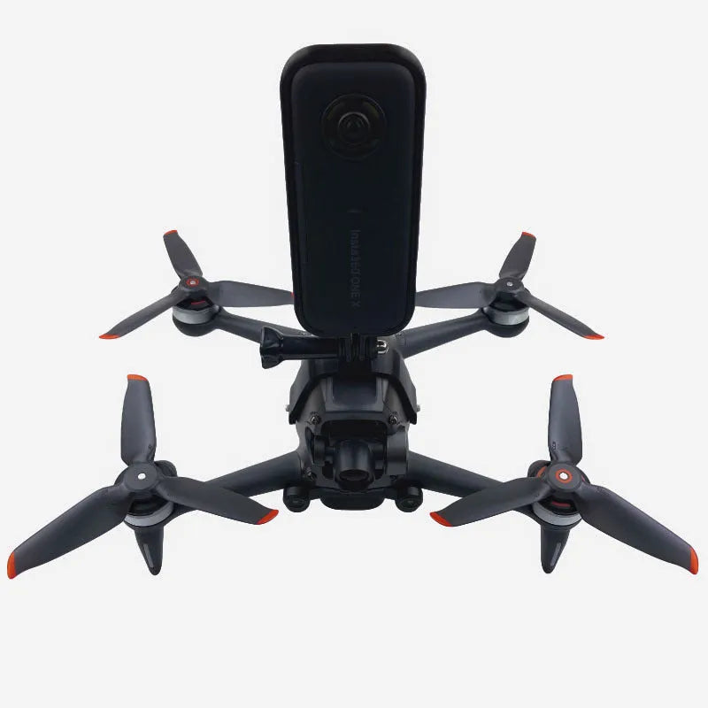 3D printed hard plastic FPV drone expansion bracket with soft sponge for top-mounting GoPro cameras.
