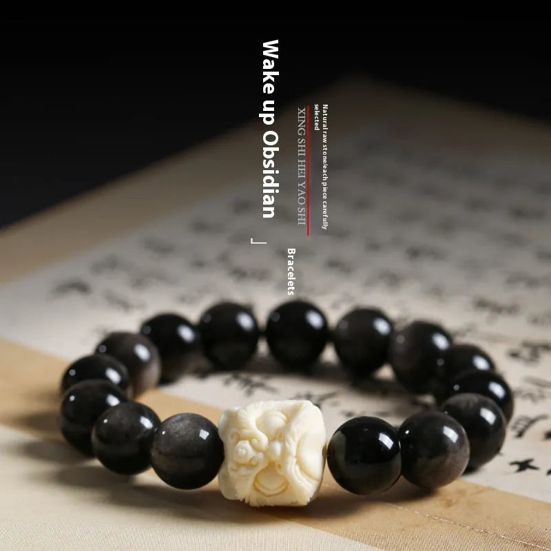 Handcrafted Xingshi obsidian prayer bead bracelet with chamfered square grain design, shown in 12mm size.