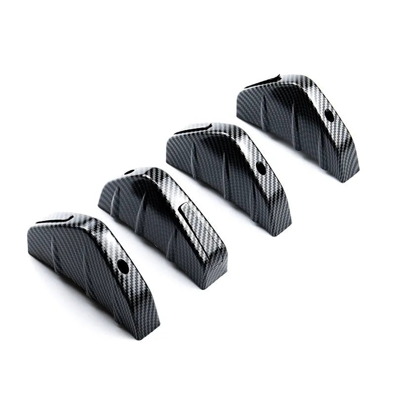 Black triangular ABS rear spoiler for cars with mounting hardware on white background