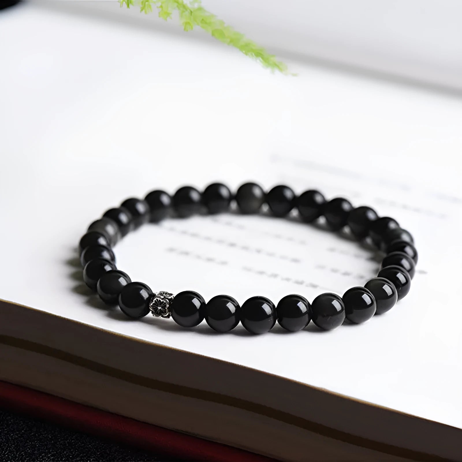 Natural obsidian bracelet with S925 silver flower charm and dragon phoenix constellation design