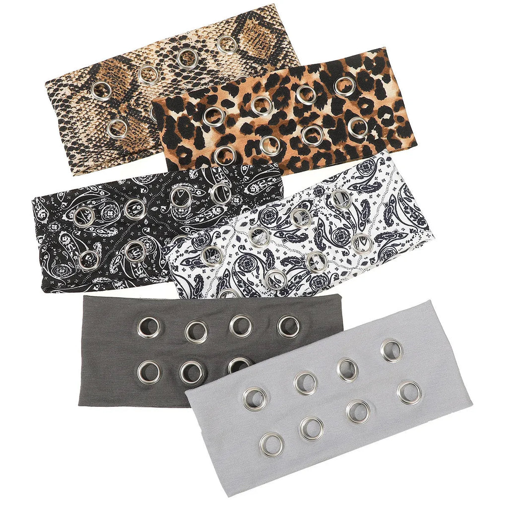 Hollow metal punk hair band with circle decoration in seven colour options on a white background.