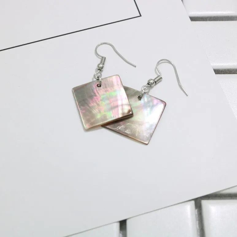 Geometric shell earrings with rectangular or square panther patterns, natural material, retro design