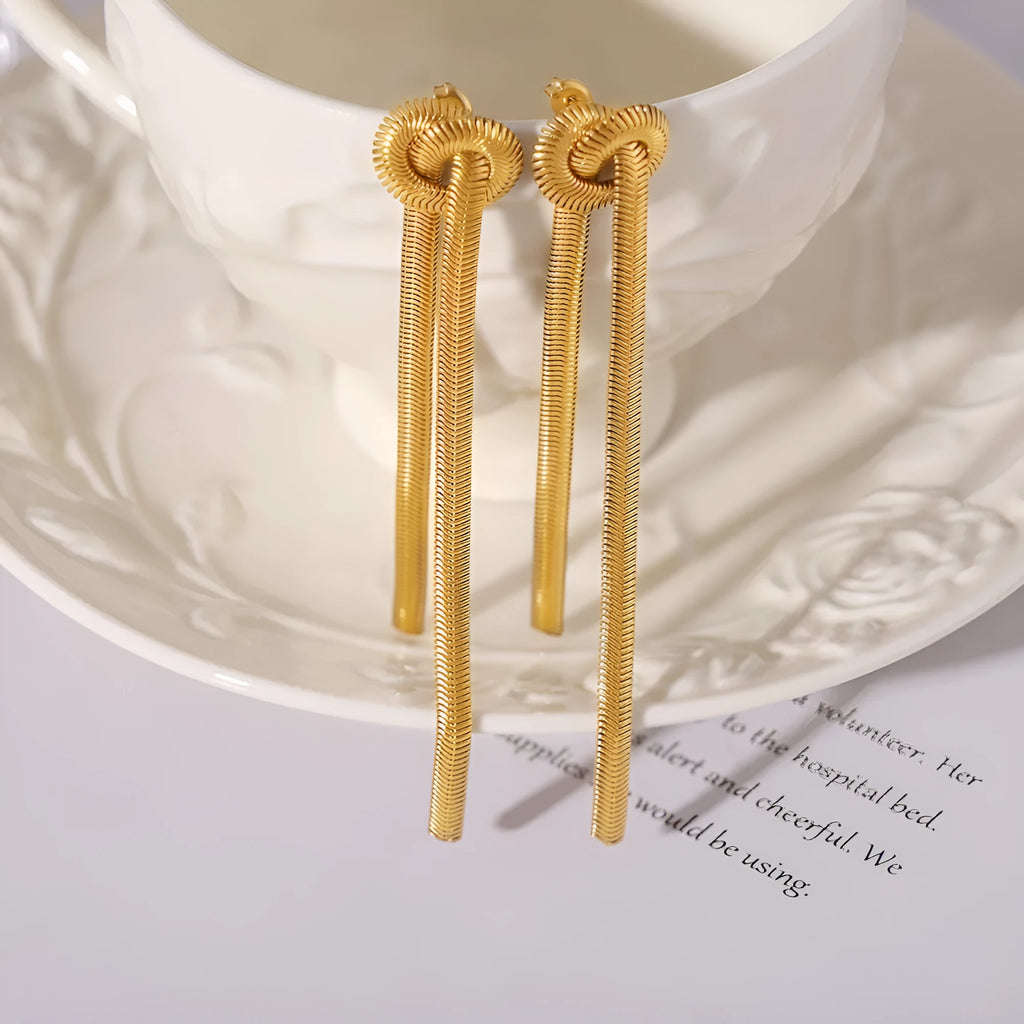 Gold-plated titanium steel necklace with knotted tassel pendant and matching earrings