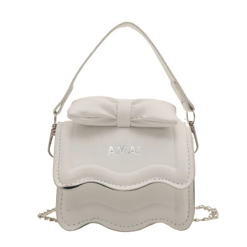 Small black PU leather crossbody bag for women with an adjustable shoulder strap.