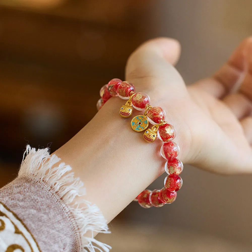 Handmade national style glass coloured glaze swallowing gold beast bracelet in fragrant grey with gold foil accents