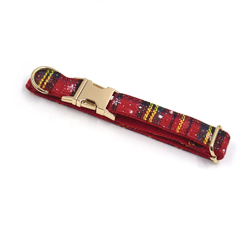Red Christmas fabric pet collar set with matching harness, rope, bow, and waste bag