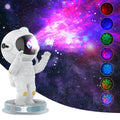 Exit Astronaut Starlight Projection Lamp 22.5cm in white on a surface projecting northern lights onto ceiling