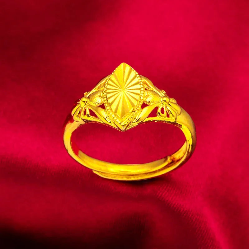 Geometric gold open ring with textured diamond flower detail on brass
