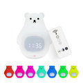 White silicone bear-shaped night light with button controls on a table.