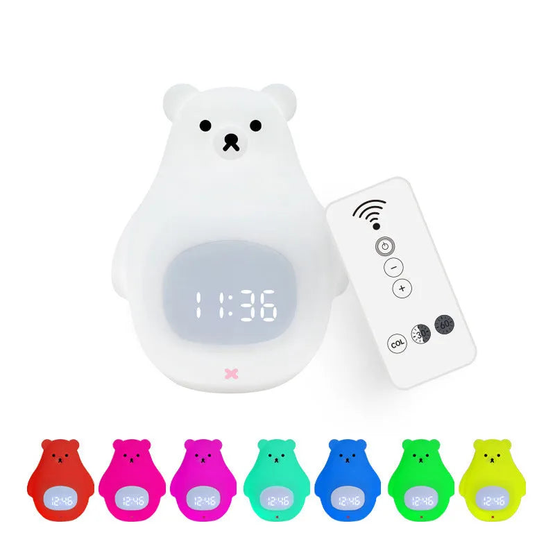 White silicone bear-shaped night light with button controls on a table.