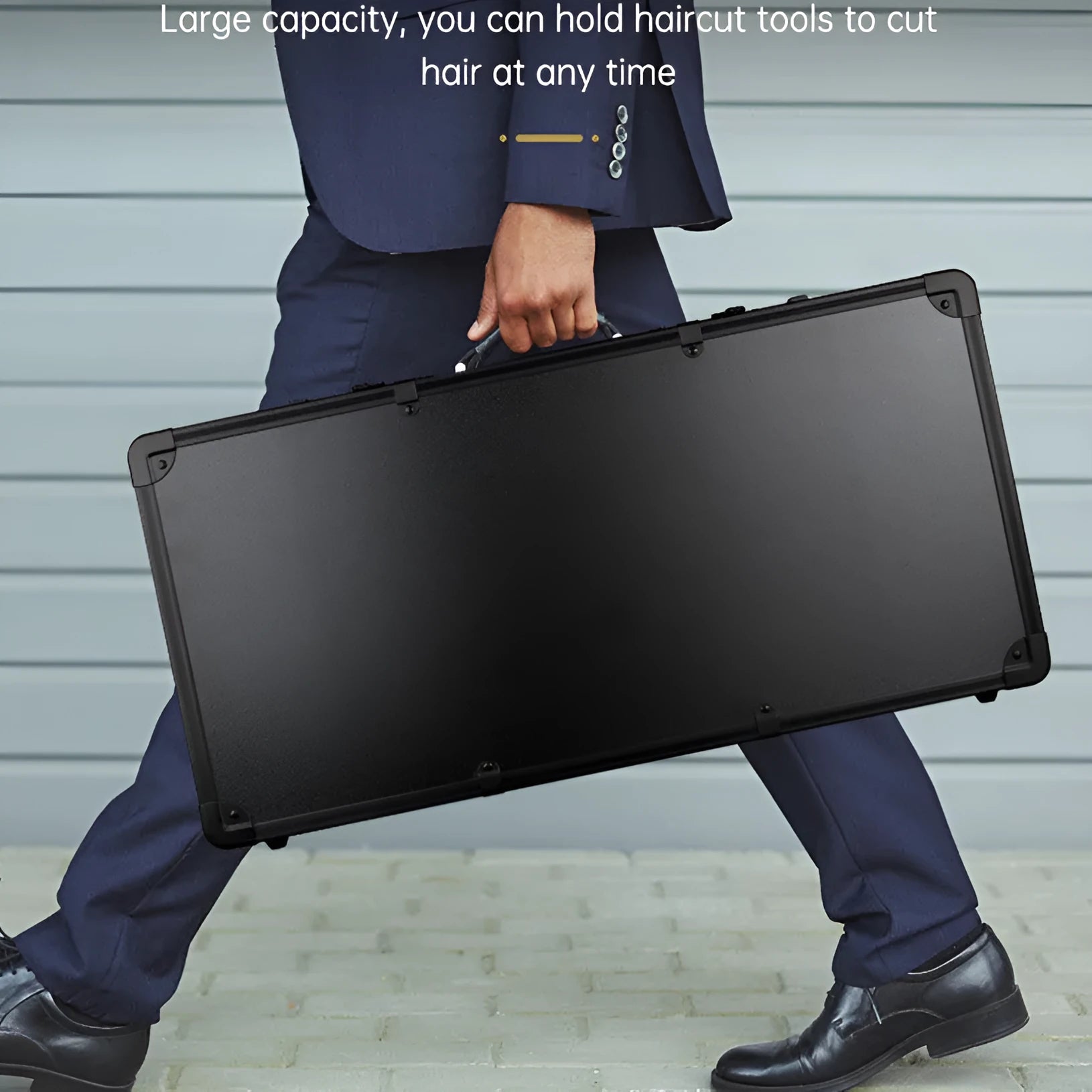 Black hard-shell PVC suitcase for storing hair styling tools like hairdryers and straighteners.