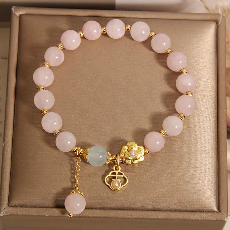Women's pink crystal flower bracelet showing floral arrangement of stones on wrist