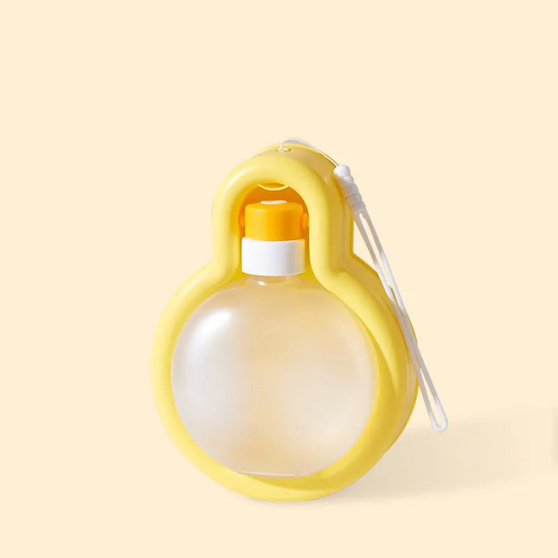 Green portable pet travel water bottle with pull-out drinking bowl for dogs, shown with size dimensions.
