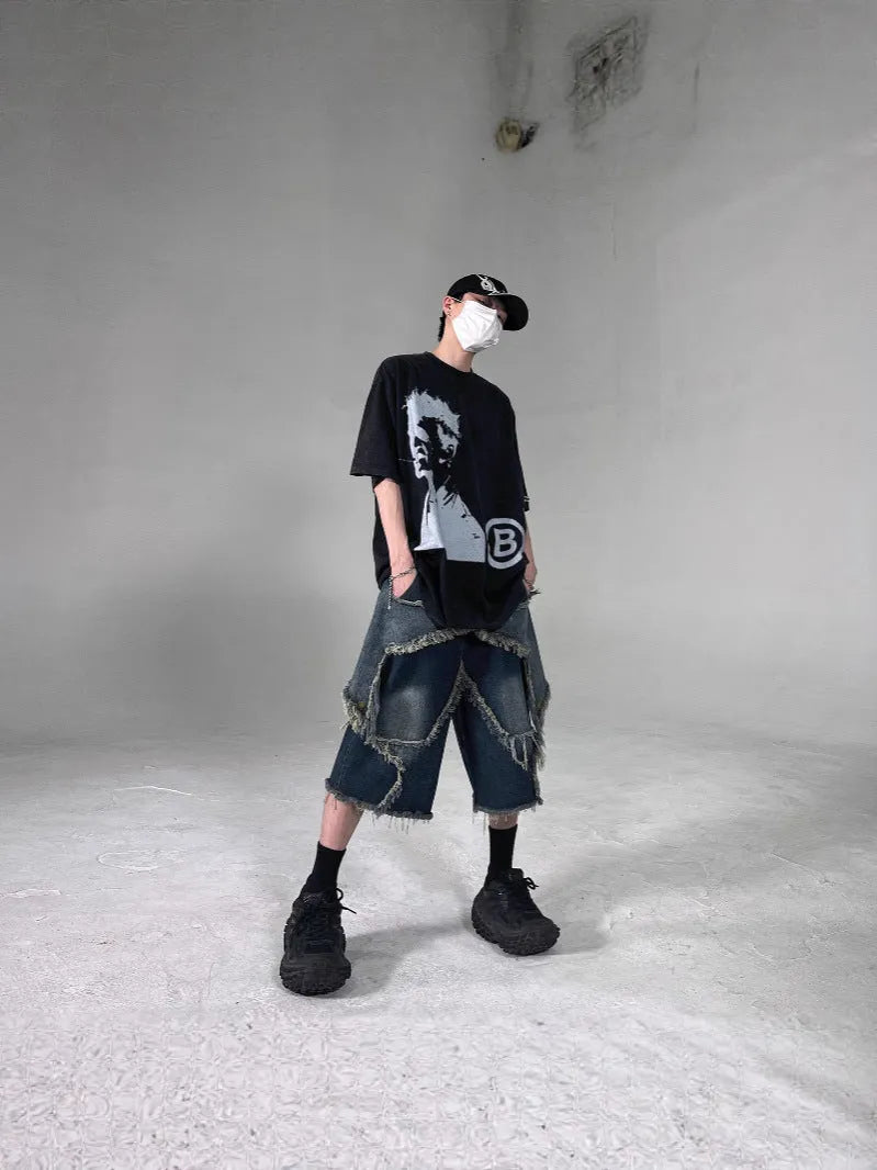 Blue retro-style men's denim shorts with a frayed five-pointed star design and a loose fit.