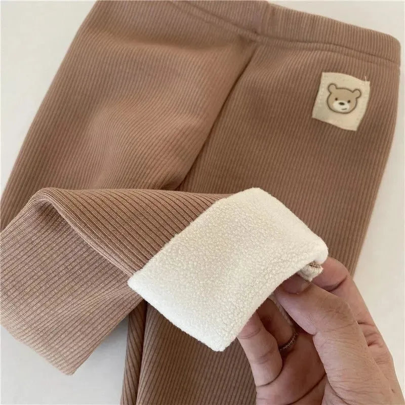Girl's high-waist fleece-lined winter leggings in solid colour with wool lining and hair band belt.