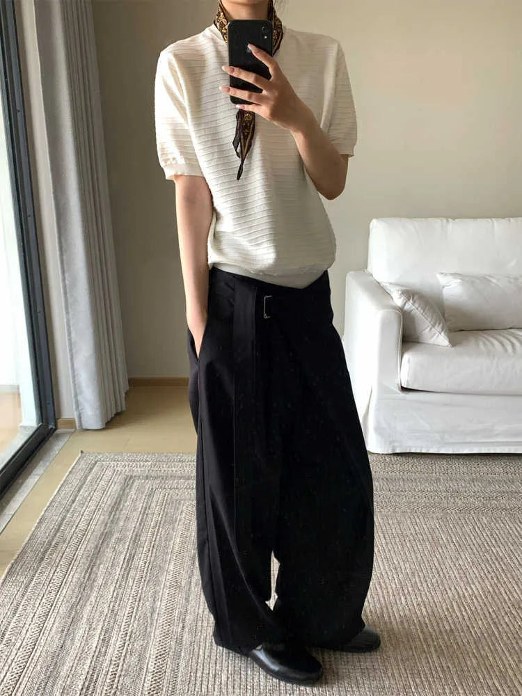 Black loose fit straight-leg trousers with single pleat front and adjustable waistband