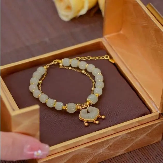 Green women's bracelet with traditional Chinese xiangyun lock pendant and safety closure