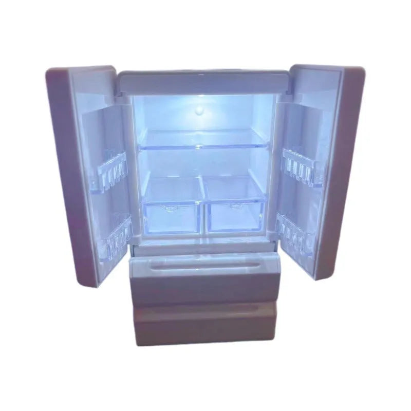 White plastic miniature candy toy model with light-up feature on display.