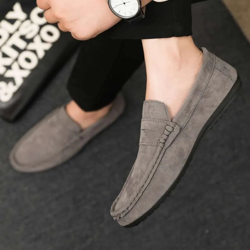 Men's Gommino Korean fashion slip-on shoes in black colour showing round toe and textured upper