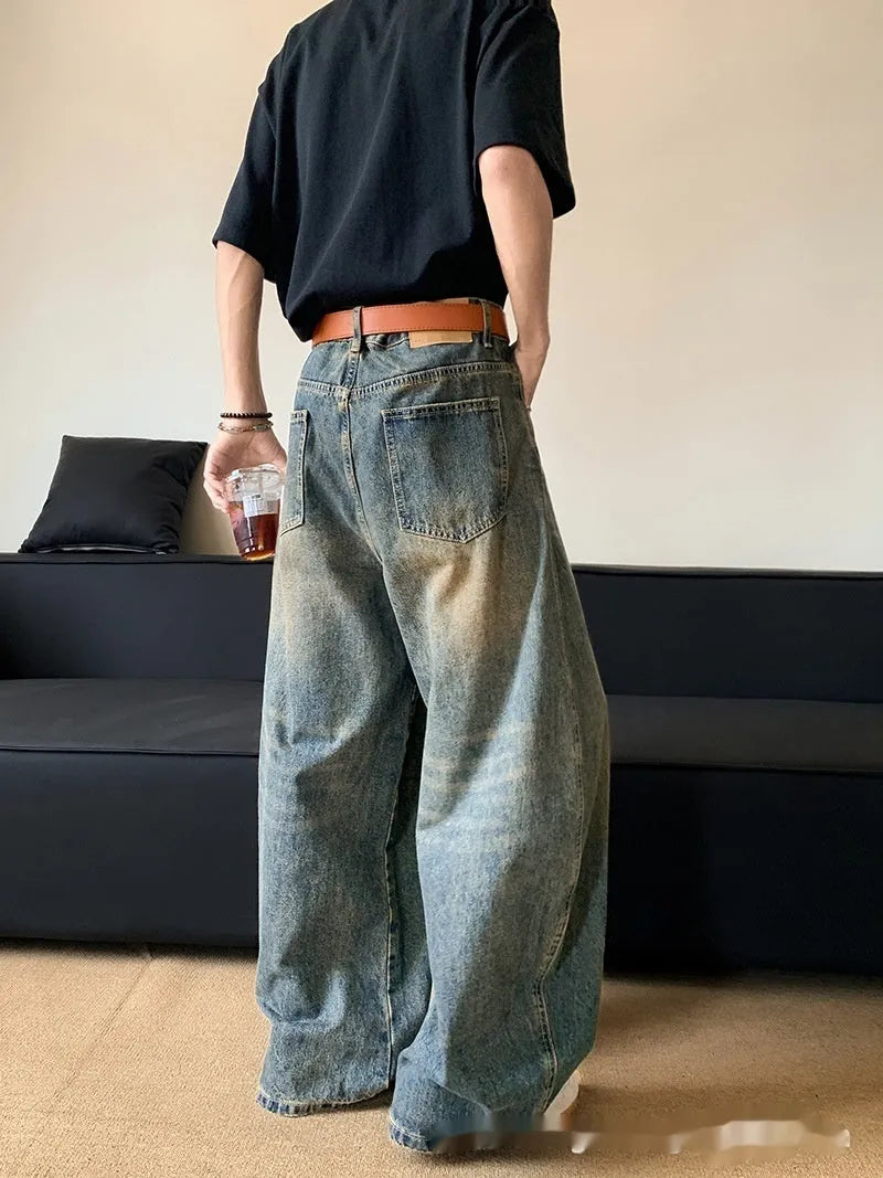Men's retro blue jeans with distressed machete detailing and slimming wide-leg cut on mid waist design