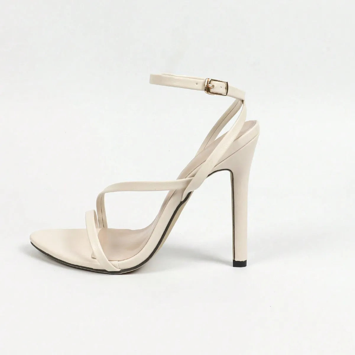 Women's gold heeled sandals with round toe open toe design and cross ankle strap on rubber sole
