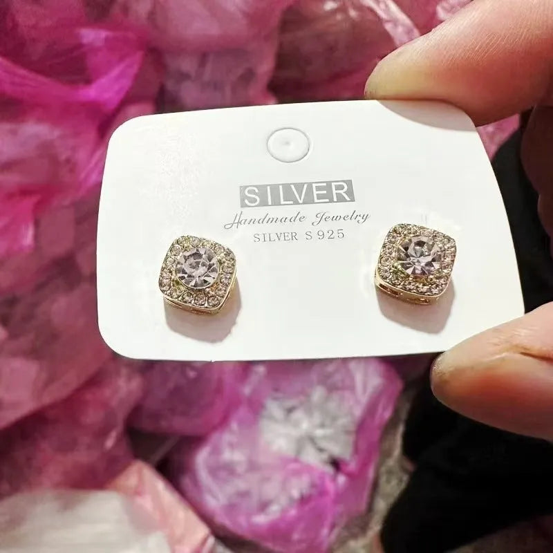 A pair of women's square geometric earrings in alloy, available in silver or gold colour options.