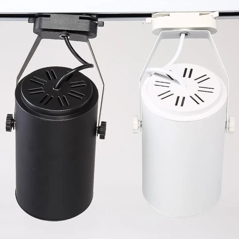 LED track spotlight with aluminium shell in black or white, available in 7W 12W 18W power outputs with warm yellow neutral white light options